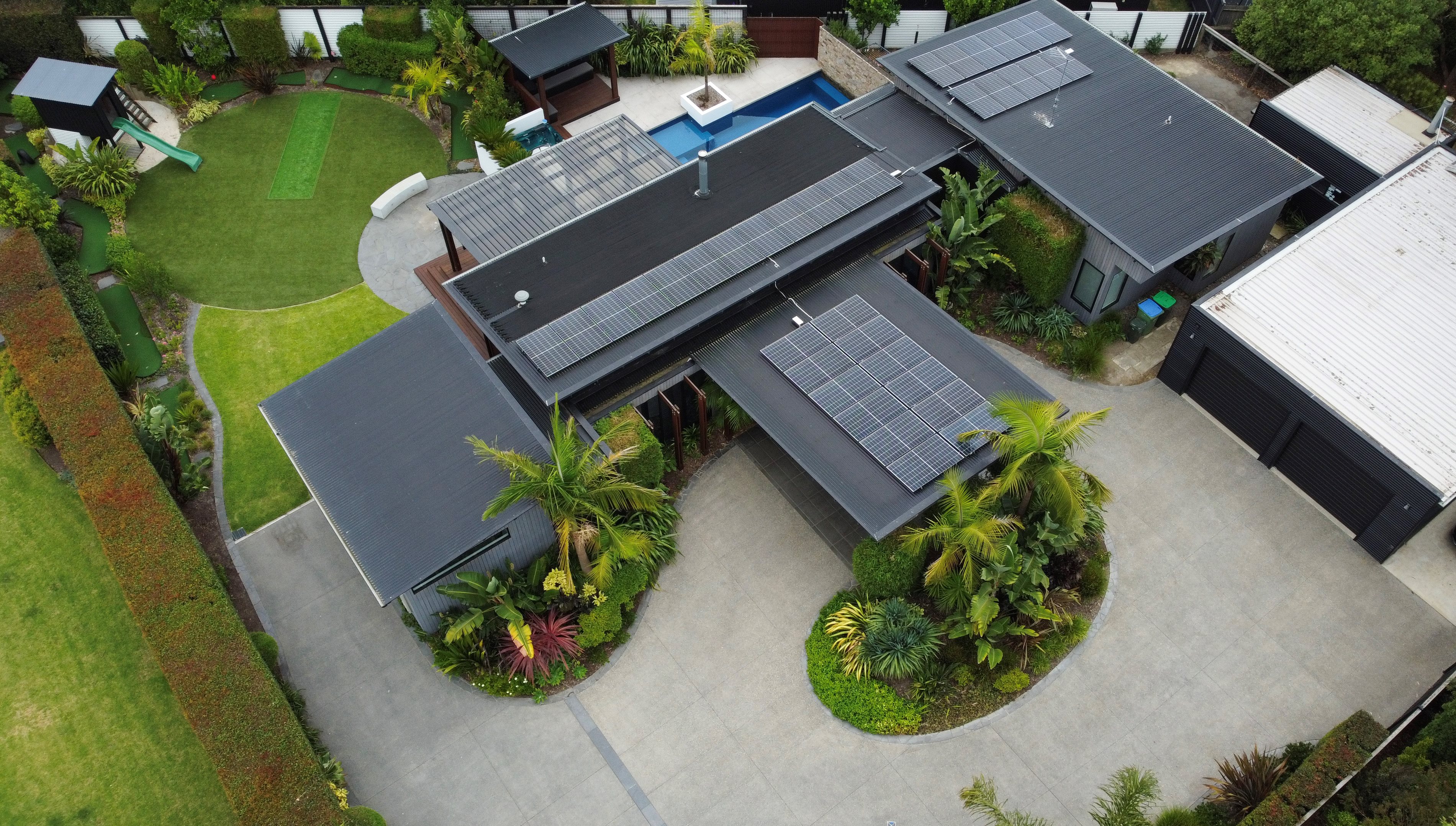 Drone photo of home, including backyard and pool
